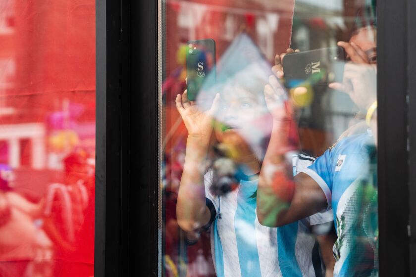 Spectators take videos during the Mexican Independence Day Parade along 26th Street in the Little Village neighborhood, Saturday, Sept. 16, 2023. | Pat Nabong/Sun-Times
