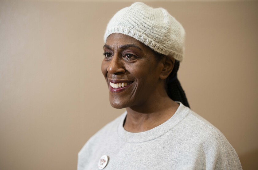 Kimberly Carlos wears a hat she knitted during the 19th YarnCon at the Plumbers Union Hall in the Near West Side on Saturday.