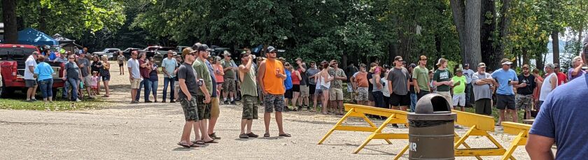 The crowd, most smartly hanging in the shade, watch the waterfowl blind draw at Marshall State Fish and Wildlife Area. Credit: Dale Bowman