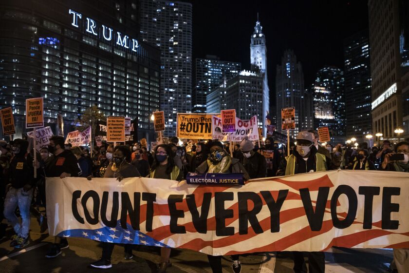 At least 1,000 protesters march through the Loop to demand every vote be counted in the general election, Wednesday night, Nov. 4, 2020. A full day after Election Day, neither candidate had cleared the 270 Electoral College votes needed to win the White House as President Donald Trump’s campaign has filed lawsuits and attempted to stop ballot counting in several key battleground states.