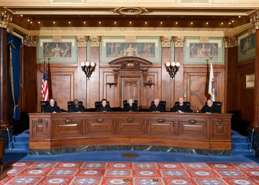 Illinois Supreme Court Justices, left to right, David K. Overstreet; P. Scott Neville, Jr.; Rita B. Garman; (Chief Justice) Anne M. Burke; Mary Jane Theis; Michael J. Burke; Robert L. Carter.