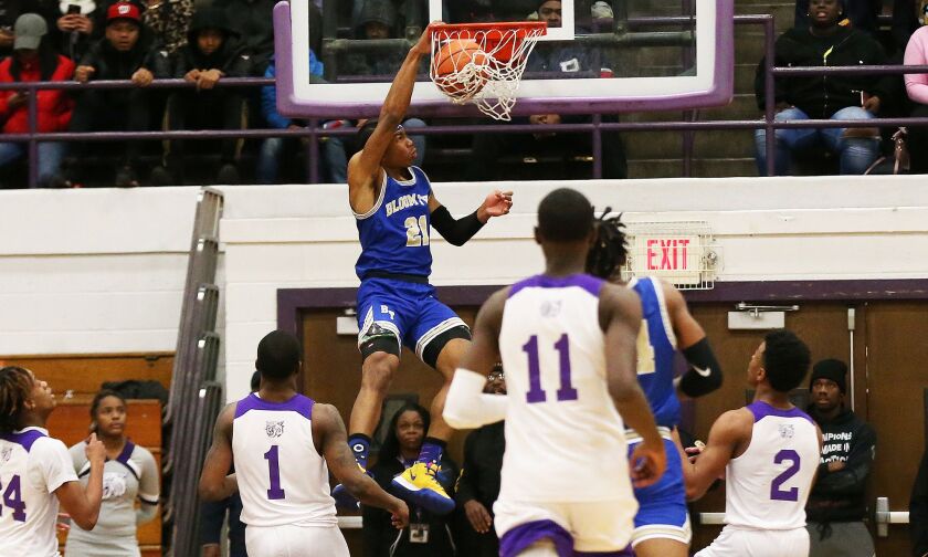 Bloom’s Dante Maddox, Jr., (21) slams home a shot against Thornton.