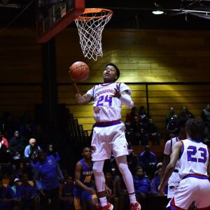 Curie’s Justin Harmon (24) pulls down a rebound. Worsom Robinson/For the Sun-Times.