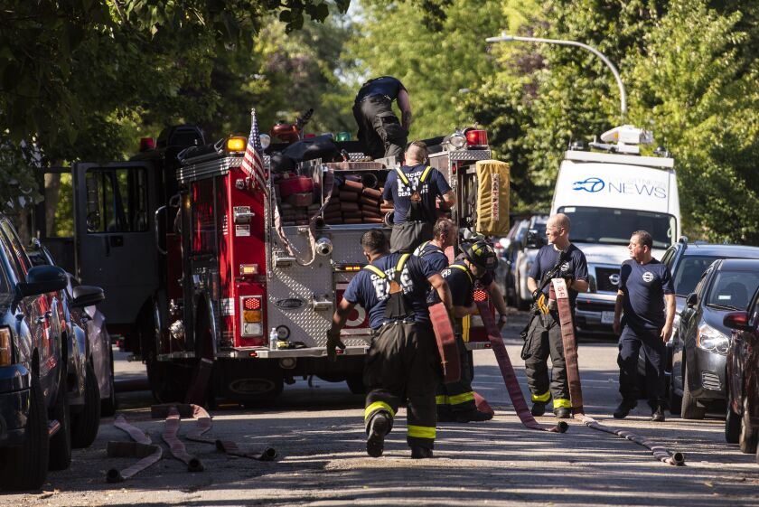 Chicago firefighters respond to a 2-11 alarm blaze at a home in the 3300 block of North Albany in the Avondale neighborhood, Thursday, Aug. 20, 2020. | Tyler LaRiviere/Sun-Times
