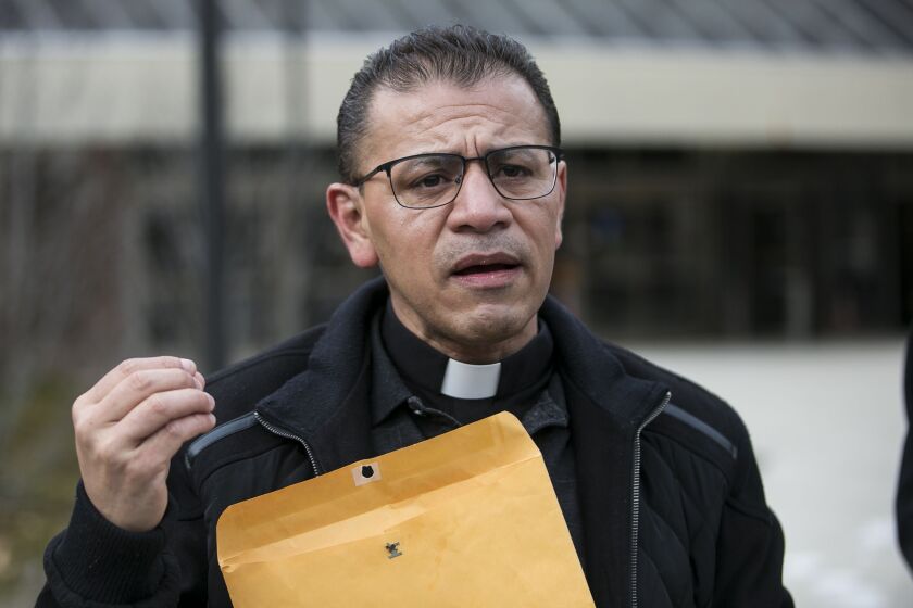 Rev. Jose Landaverde, of Faith, Life and Hope Mission in West Chicago, speaks during a press conference outside the Skokie courthouse about the ICE arrest of DACA recipient 29-year-old Christian Gomez Garcia, on Wednesday, Jan. 31, 2018. | Ashlee Rezin/Su