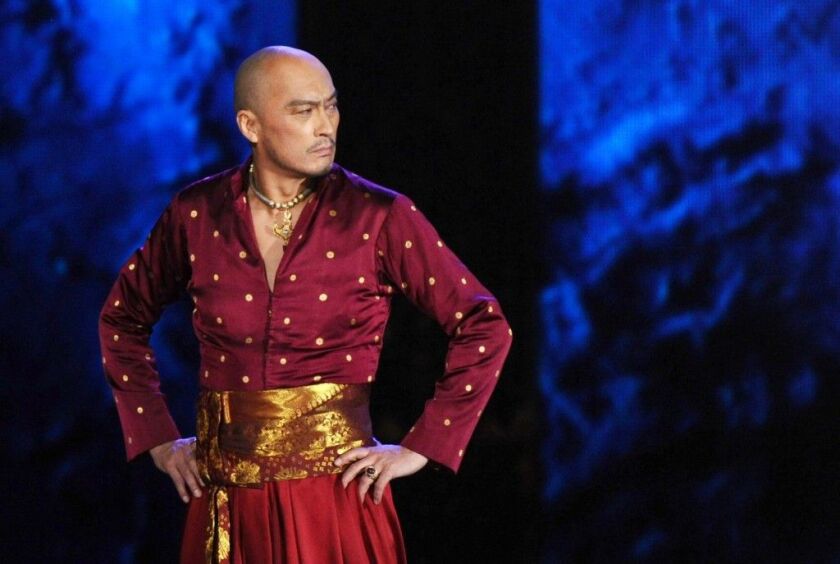 Actor Ken Watanabe performs a number from “The King and I” at the 69th annual Tony Awards in New York in 2015. A publicist for Watanabe says the Tony Award- and Oscar-nominated actor has been forced to delay his return to Broadway’s “The King and I” while