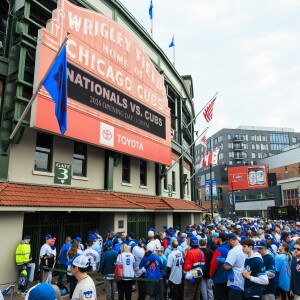 Fans wait in line Thursday to enter Wrigley Field on the Chicago Cub’s opening day.