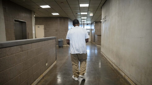 Ivy Kelly, who is incarcerated at Division 9 of the Cook County Department of Corrections and maintains his innocence after serving 26 years, walks to the elevator before resuming his work inside the jail, Friday, June 12, 2026. Kelly was offered to walk free if he pleaded guilty to murdering his best friend. He denied the offer and maintains his innocence.