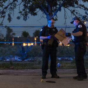 Chicago police work a crime scene where a man was shot in the head and his vehicle stolen in the 6400 block of South Cicero Avenue, Monday May 24, 2021. The man was helping change a friend’s flat tire when he was shot.
