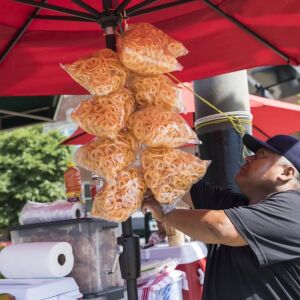 Felipe Vallarta, 58, an elotero, serves chicharrónes in Rogers Park. | Ashlee Rezin/Sun-Times