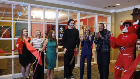 Members of the Chicago Bulls organization and Ronald McDonald house celebrate during the unveiling of a new community space led by the Josh Giddey Family Foundation at the Ronald McDonald House
