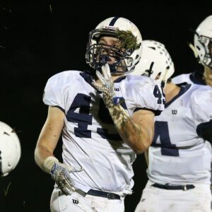 Cary-Grove’s Jacob DiMatteo (45) shakes a little sod out of his grill. Allen Cunningham/For the Sun-Times.