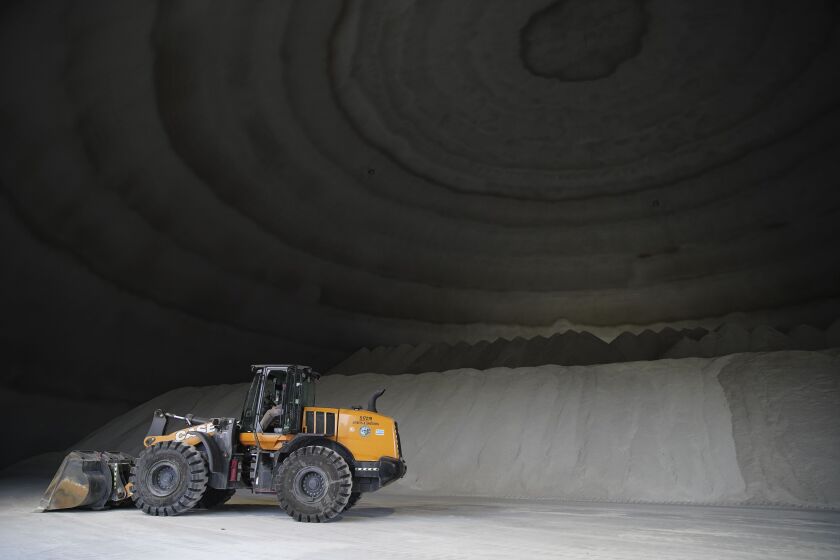 A bulldozer and a snow plow inside the new salt dome, Monday, Nov. 29, 2021 at 2555 W. Grand Ave in West Town. | Anthony Vazquez/Sun-Times