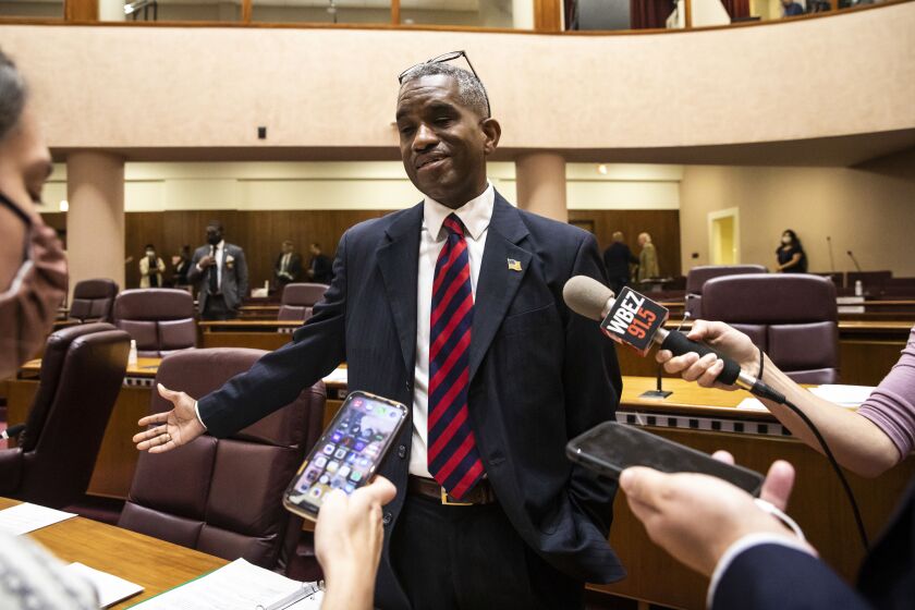 Ald. David Moore (17th) speaks with reporters after a Chicago City Council meeting last year.