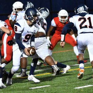 Payton QB Sage Shindler (9) hands the ball off.