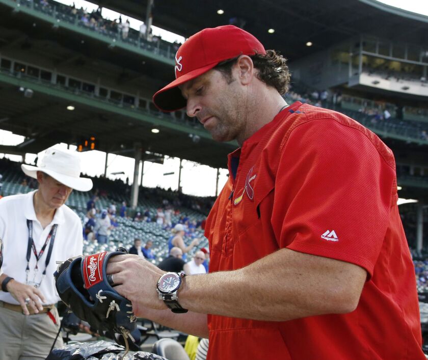 St. Louis Cardinals manager Mike Matheny and his watch. | Nam Y. Huh/AP