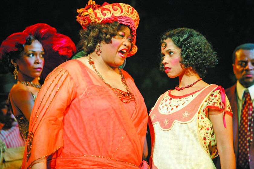 Sofia (Felicia P. Fields, left) has some strong words for Squeak (Stephanie St. James, right) in this scene from the first national touring production of “The Color Purple.”