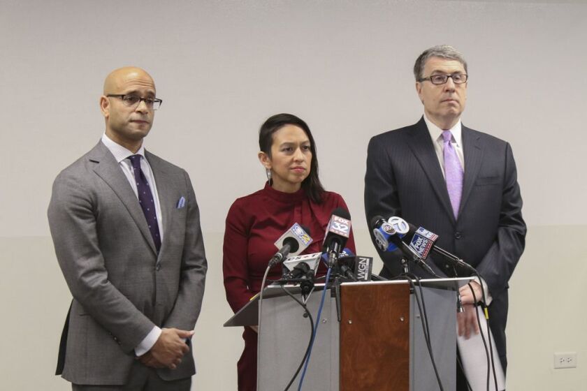 Attorneys Andrew M. Stroth (left), Gloria Schmidt Rodriguez (middle), and Gregory Kulis (right) will represent Ariel Roman, the unarmed man who was shot by police at the Grand Red Line stop on Feb. 28.