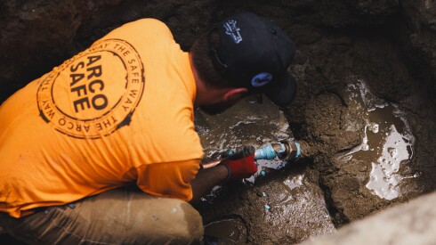 Kyle Perez works on installing the new copper water line at John Albrego’s home in West Ridge, Friday, July 25, 2025. | Anthony Vazquez/Sun-Times