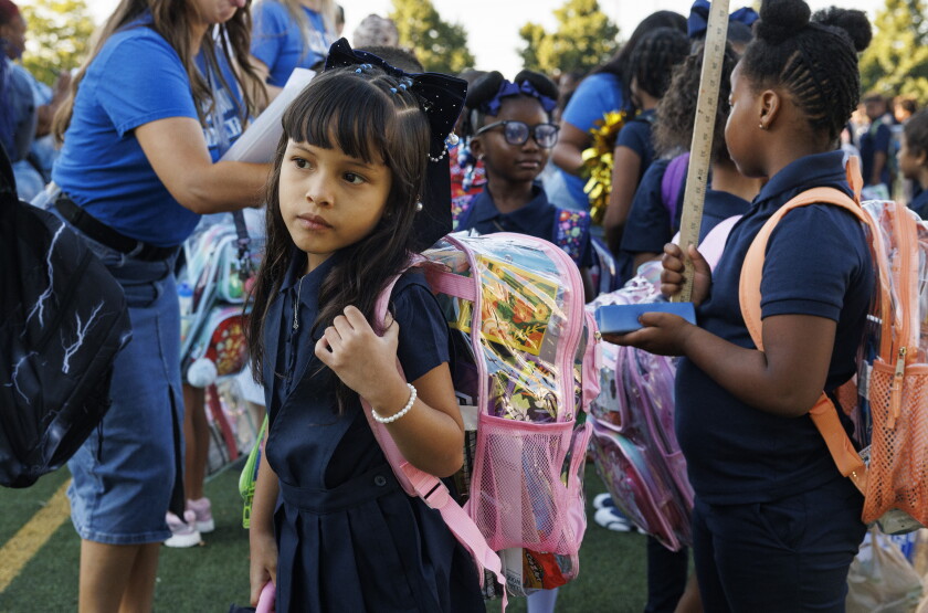 Students wait with their classmates Monday on the first day of school at George Leland Elementary School at 512 S. Lavergne Ave. in Austin.