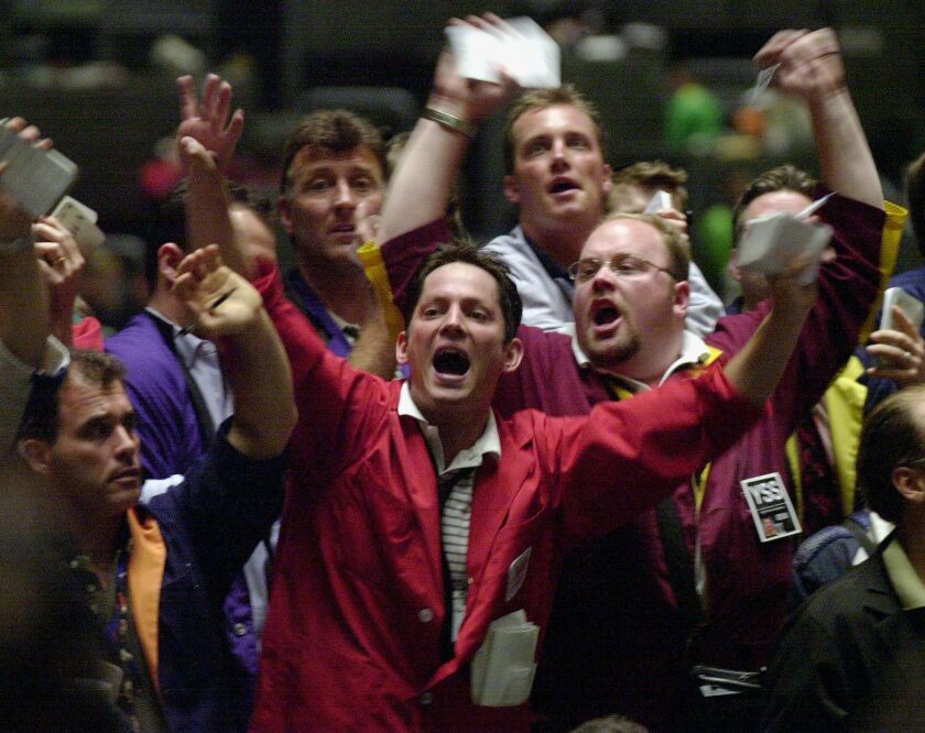 Open outcry trading as it was in 2001 at the Chicago Board of Trade’s trading pits, with traders John Murray (center) and Bryan Thomas Shaughnessy (goatee, glasses).
