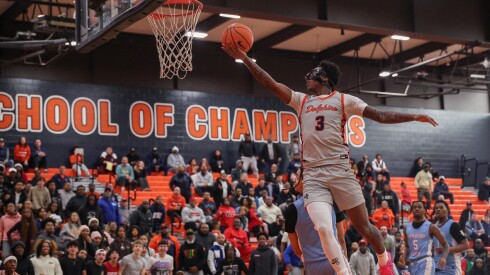 Young's Marquis Clark (3) delivers the ball to the basket against against Kenwood.