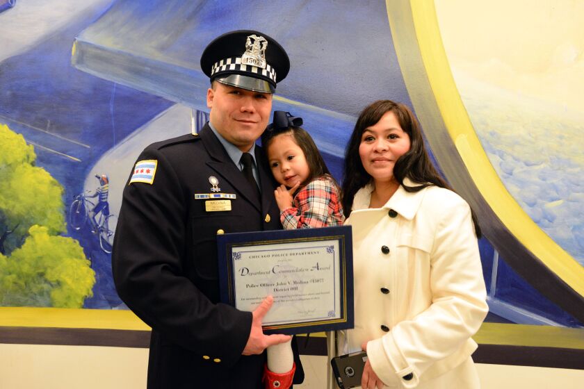 <small><strong> Chicago Police Officer John Medina, Madison Medina 2 1/2 and Lilia Hurtado at the Chicago Police Department Commendation Ceremony. Tuesday, January 20, 2015 | Brian Jackson/ Sun-Times</strong></small>