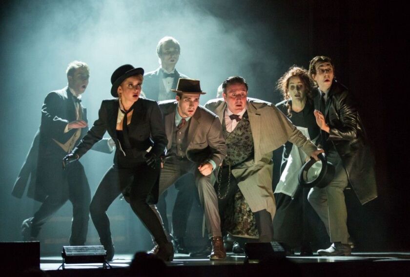 A scene from “Sherlock Holmes,” with (at center) Renee Olstead, James Maslow and David Arquette. The show plays at Chicago’s Oriental Theatre through Nov. 29.