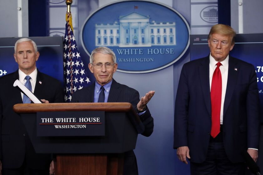 President Donald Trump and Vice President Mike Pence listen as Dr. Anthony Fauci speaks about the coronavirus last month.