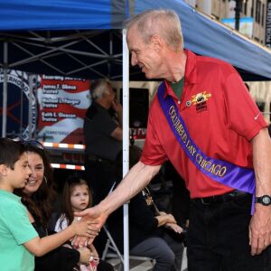 Teddy Sparagis of Oak Brook meets Governor Bruce Rauner during the Columbus Day Parade in Chicago Monday, October 9, 2017. | Kevin Tanaka/For the Sun Times