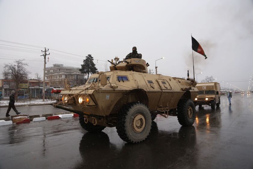Afghan security personnel arrive at the site of an attack at the Marshal Fahim academy in Kabul, Afghanistan on Monday. | AP photo
