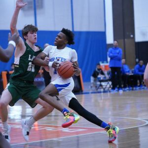 Proviso East’s Devin Spencer (1) pushes past Lane’s Louis Perona (23) for a basket, Wednesday 02-27-19. Worsom Robinson/For Sun-Times