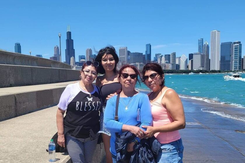 Rosa M. Hernandez, (blue top) in an undated photo with family and friends.