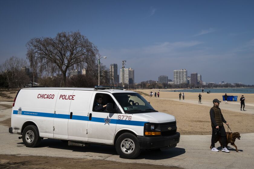 Chicago Police patrol near North Avenue Beach as hundreds could be seen enjoying warm weather along the lakefront Wednesday afternoon.
