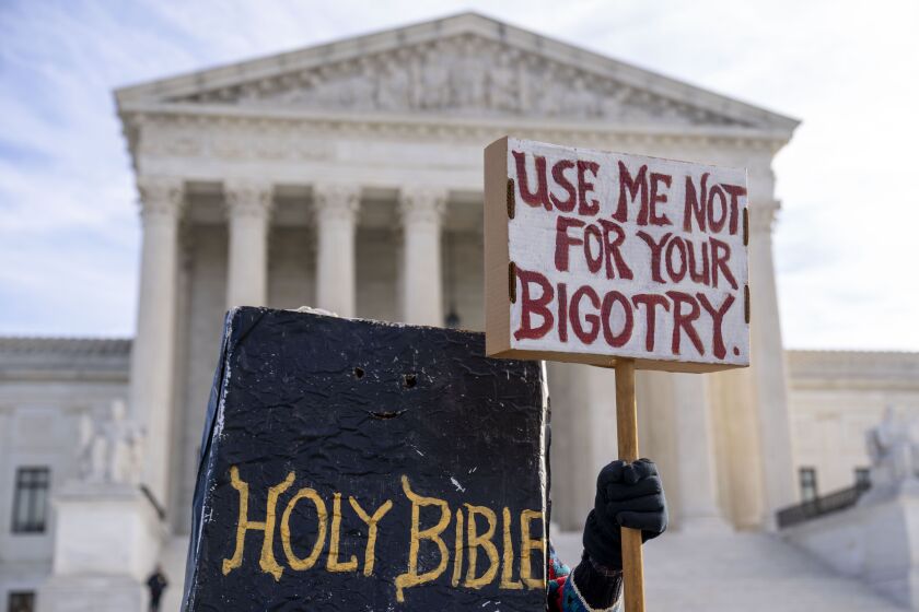 Supreme Court hears case of graphic designer who wants to refuse to do work for gay couples 3 A person dressed as a Bible protests outside the Supreme Court in Washington on Monday, Dec. 5, 2022, where the Supreme Court heard the case of a Christian graphic artist who objects to designing wedding websites for gay couples.