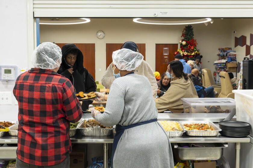 Volunteers at Lincoln Park Community Services serves food to guests during Chicago’s annual point-in-time count. | Tyler Pasciak LaRiviere/Sun-Times