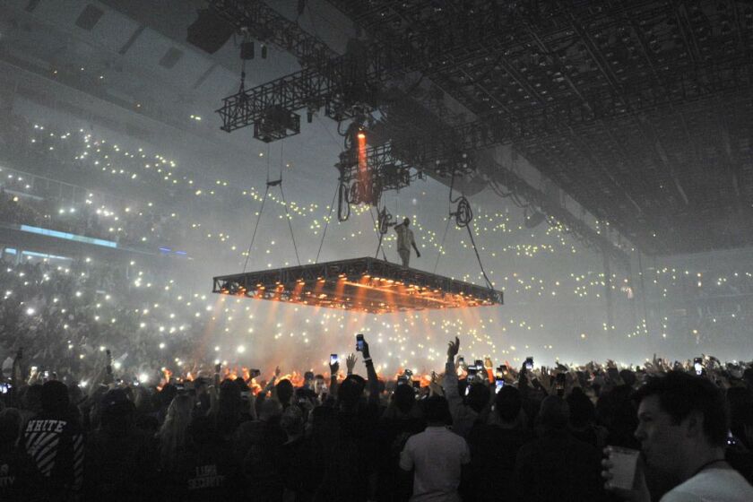Kanye West descends into the arenat at the United Center on Friday, Oct 7, 2016, in Chicago. (Photo by Rob Grabowski/Invision/AP)