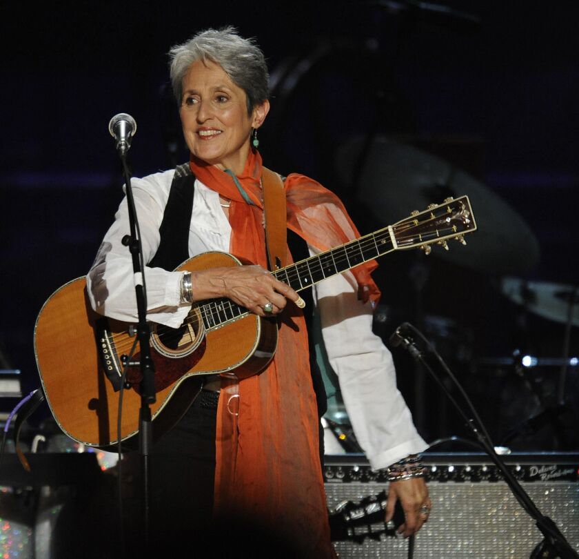 Joan Baez smiles during a concert for folk music legend Pete Seeger at Madison Square Garden in New York on May 3, 2009. | TIMOTHY A. CLARY/AFP/Getty Images