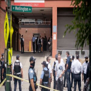 Police officers gather outside Advocate Illinois Masonic Medical Center after an officer was shot at the 25th District police station on the Northwest Side, Thursday, July 30, 2020.