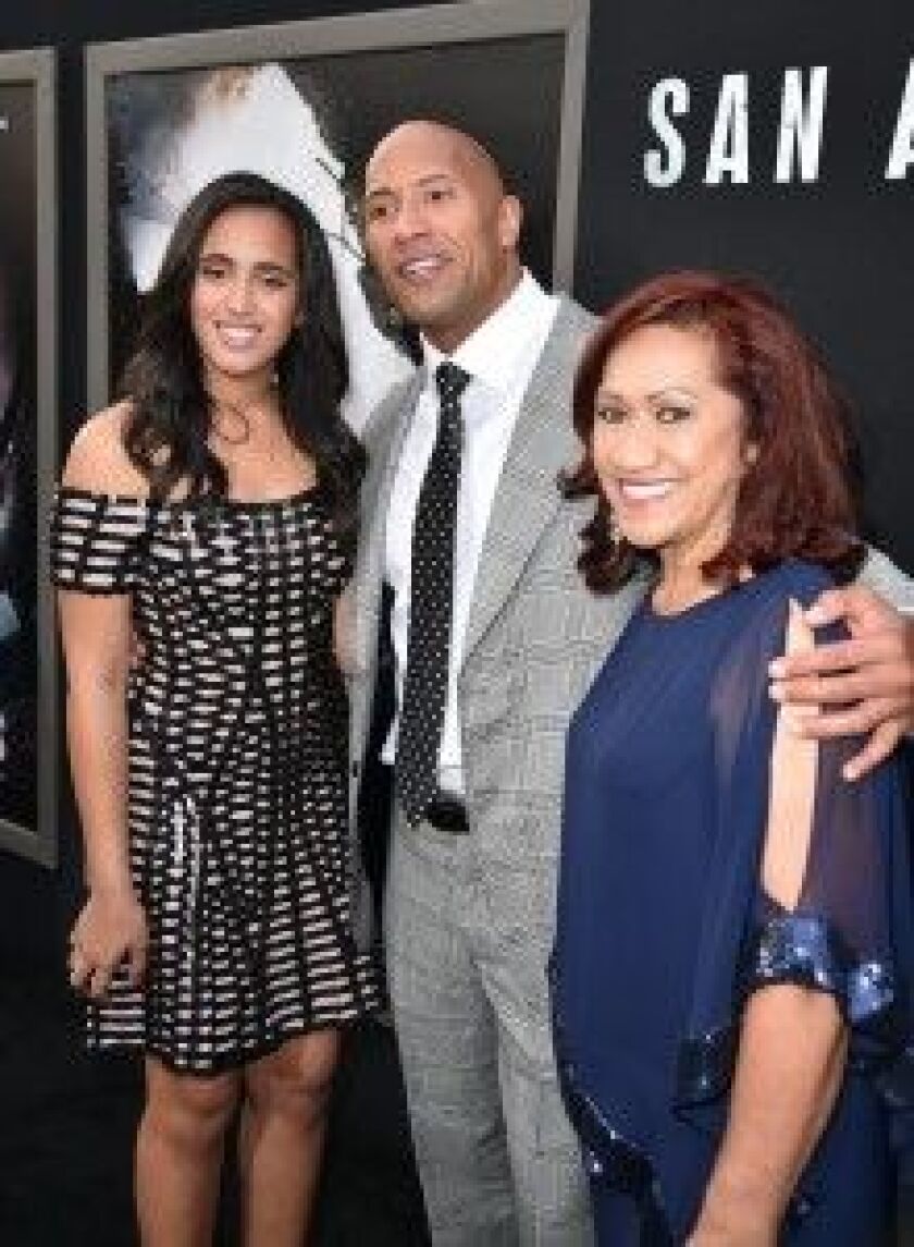 Dwayne Johnson attends a “San Andreas” premiere with daughter Simone (left) and his mother, Ata Johnson. | Kevin Winter/Getty Images