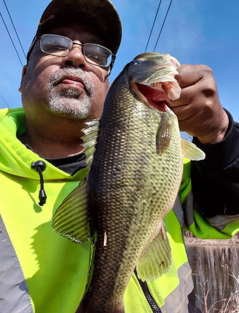 Victor Blackful with a Kankakee River largemouth bass. Provided photo