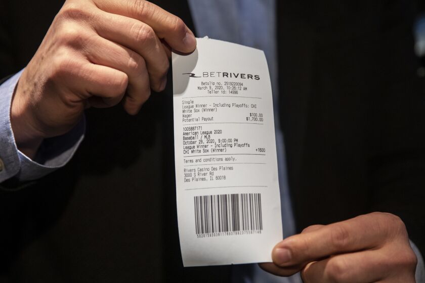 Blackhawks announcer Eddie Olczyk makes Illinois’ first sportsbook wager and puts $100 down on his hometown White Sox to win the American League pennant at 16-to-1 odds at BetRivers Sportsbook in Rivers Casino in Des Plaines, Monday morning, March 9, 2020.