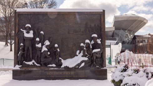 A Soldier Field statue is blanketed in snow after the snowiest November day ever recorded in Chicago, Sunday, Nov. 30, 2025.