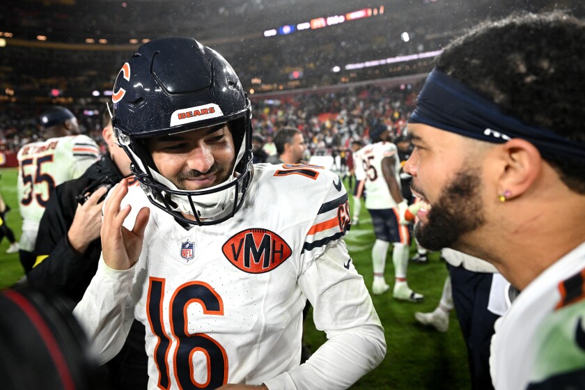 Bears kicker Jake Moody celebrates with quarterback Caleb Williams after the victory against the Washington Commanders at Northwest Stadium on Oct. 13, 2025, in Landover, Maryland.