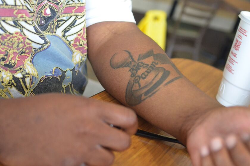 <small><strong>Sedrick Prude’s handle is tattooed on his arm. Prude is a chess instructor who works at several schools in the city and suburbs. | Mitch Dudek/Sun-Times<br></strong></small>
