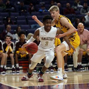 St. Ignatius’s Christian Davis (3) drives past Loyola’s Jordan Kwiecinski (2) in their 56-46 loss at Northwestern University in Evanston, Friday, February 8, 2019. | Kevin Tanaka/For the Sun Times