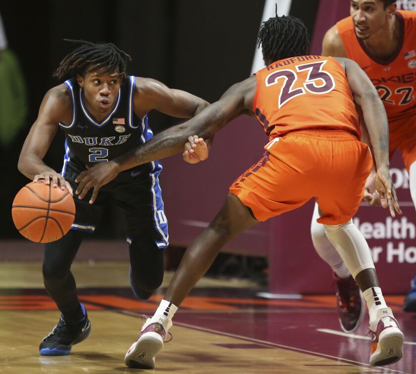 Duke’s DJ Steward (2) drives around Virginia Tech’s Tyrece Radford (23) after getting a defensive rebound during the second half of an NCAA college basketball game Tuesday, Jan. 12, 2021.