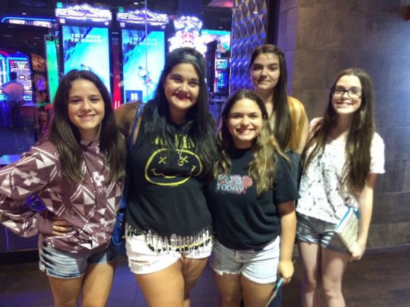 Stephanie Odeshoo, 16, (from left), Nicole Capesius, 16, Sophie Nunez, 13, Corra Palecki, 16 and Kayleen Haile, 13, attend a Super League Gaming in-theater event on Tuesday, July 8, 2015, at AMC River East.<br>| MIRIAM DI NUNZIO/FOR THE SUN-TIMES