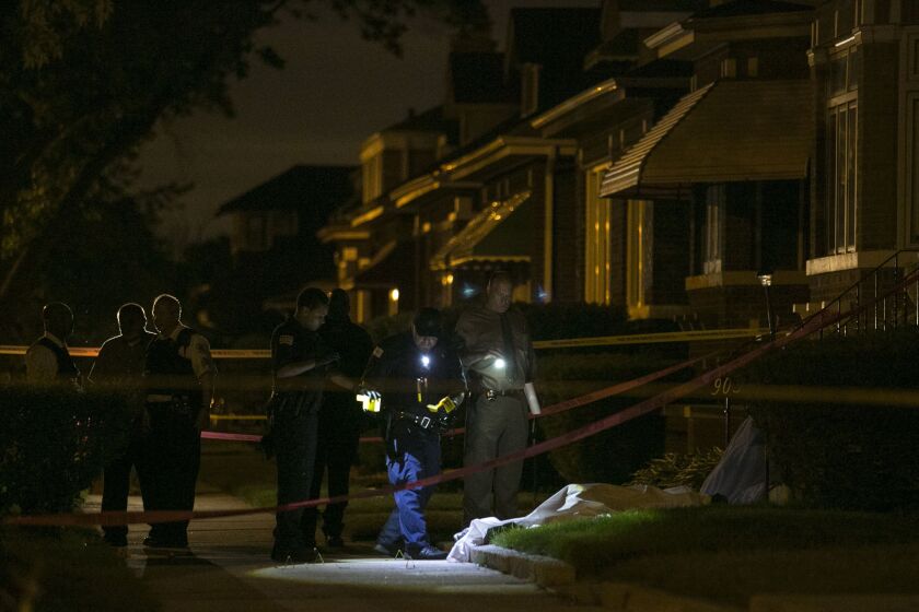 Chicago Police investigate in the 9000 block of South Marshfield, where two men were shot to death on a porch early Sunday, June 12, 2016. | Ashlee Rezin/Sun-Times