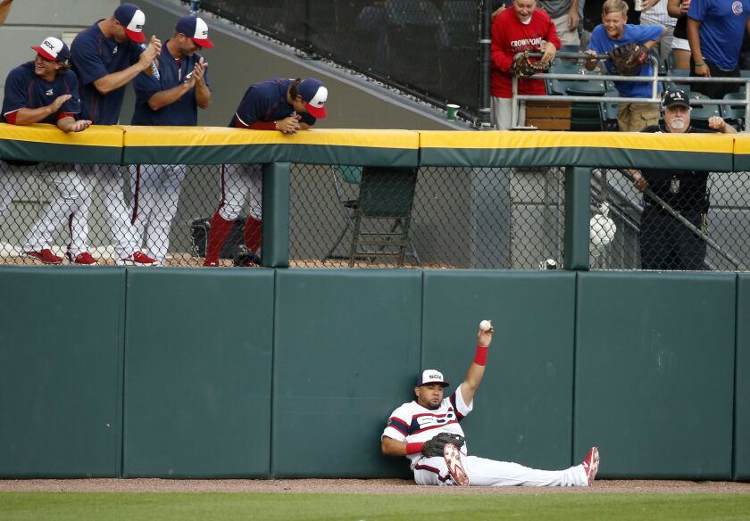 <em>Melky Cabrera shows the ball after robbing Kris Bryant of a would-be home run during the first inning of a baseball game Monday, July 25, 2016, in Chicago. (AP Photo/Charles Rex Arbogast)</em>